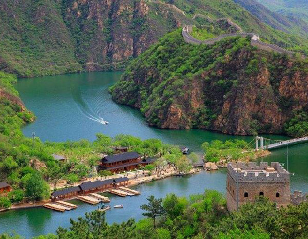 Leisure boat cruise on the lake at the foot of Huanghuacheng Great Wall