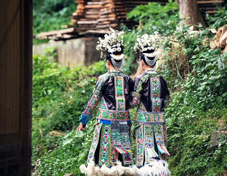 Girls at Baibei Miao Village Wearing theirBeautiful Hundred-bird Dress